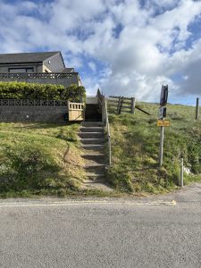 Steps to chalet with handrail from top to bottom